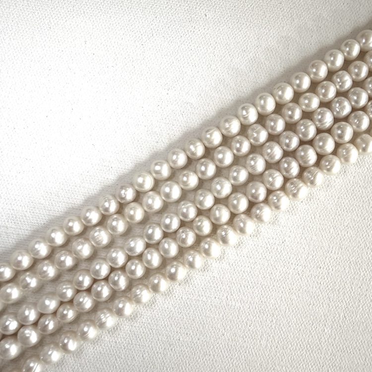 Medium round Freshwater Pearl beads by string
