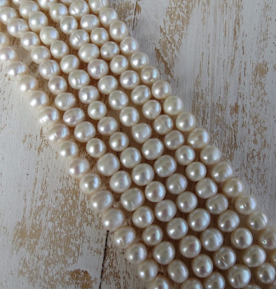 Medium slightly uneven Freshwater Pearl beads by string