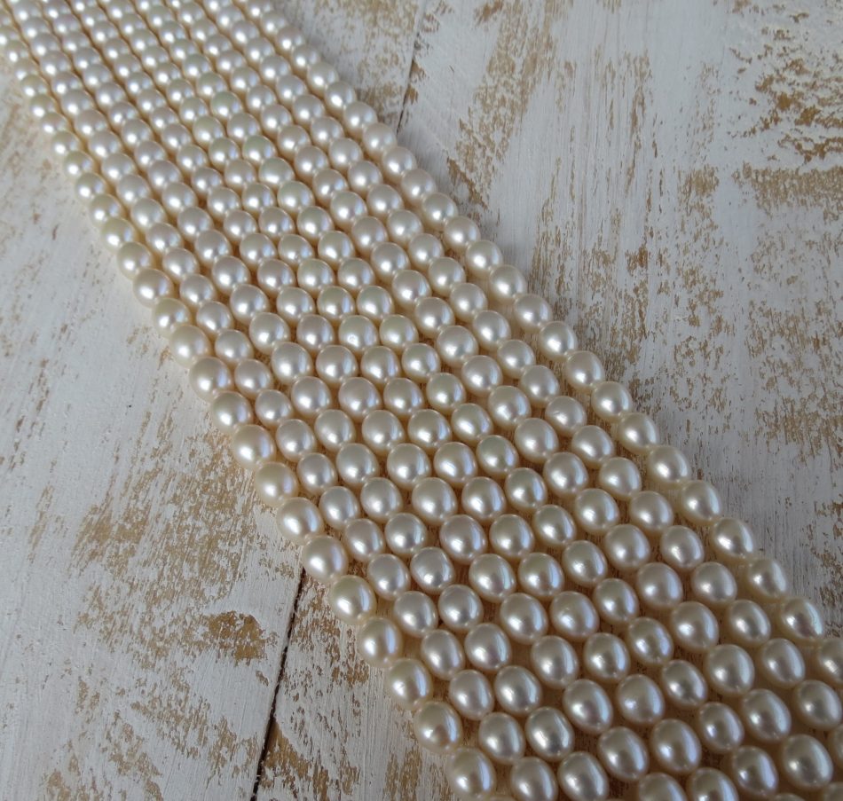 Medium oval smooth Freshwater Pearl beads by string