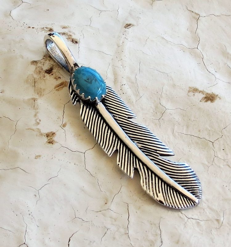 Sterling silver feather pendant with Turquoise