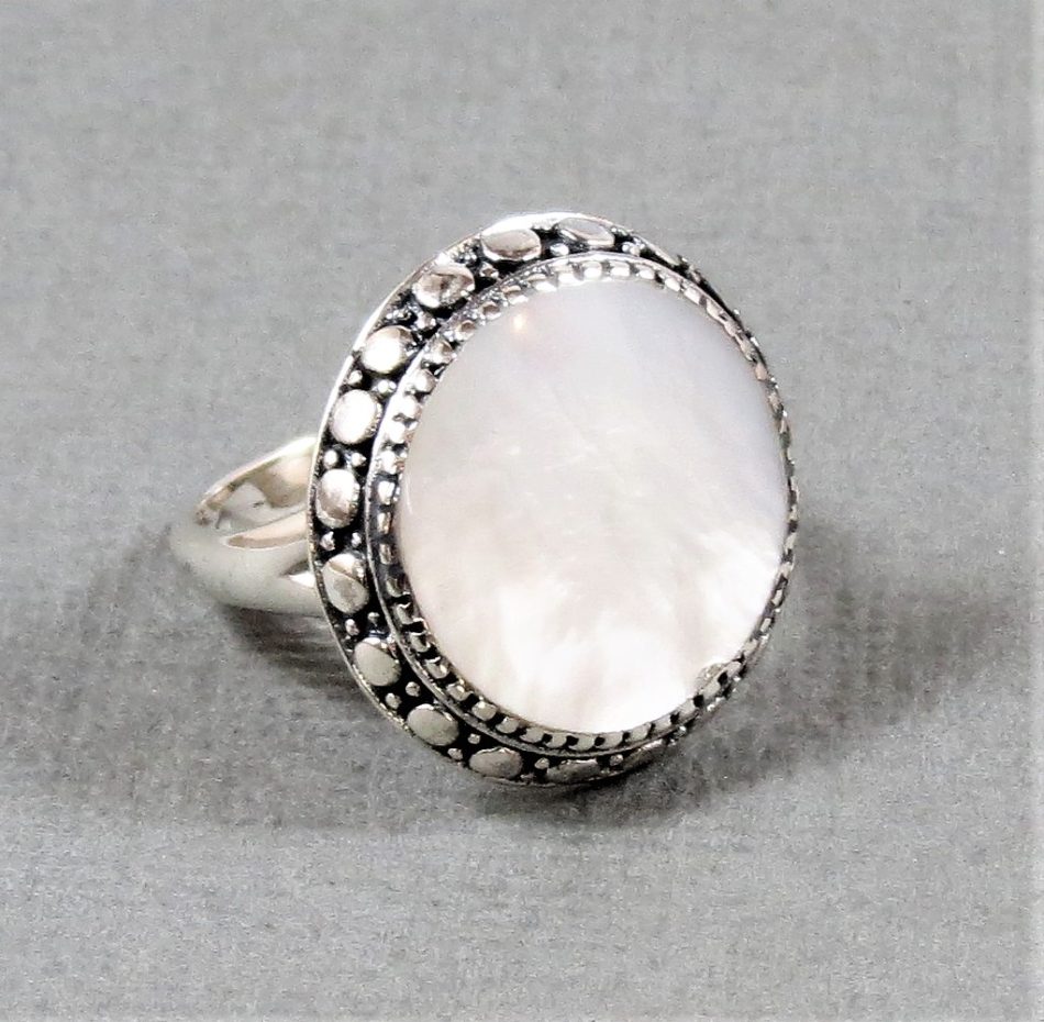 mother of pearl round ring with dotted sterling silver border