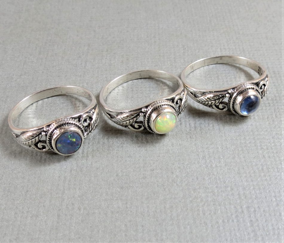 various gemstone rings with sterling silver leaf detail