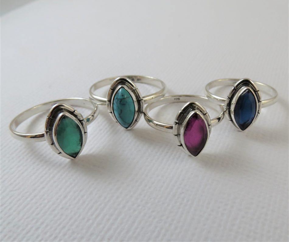 elliptical sterling silver and various gemstone ring