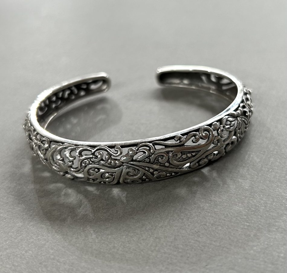 Sterling silver cuff bangle with intricate butterfly detail