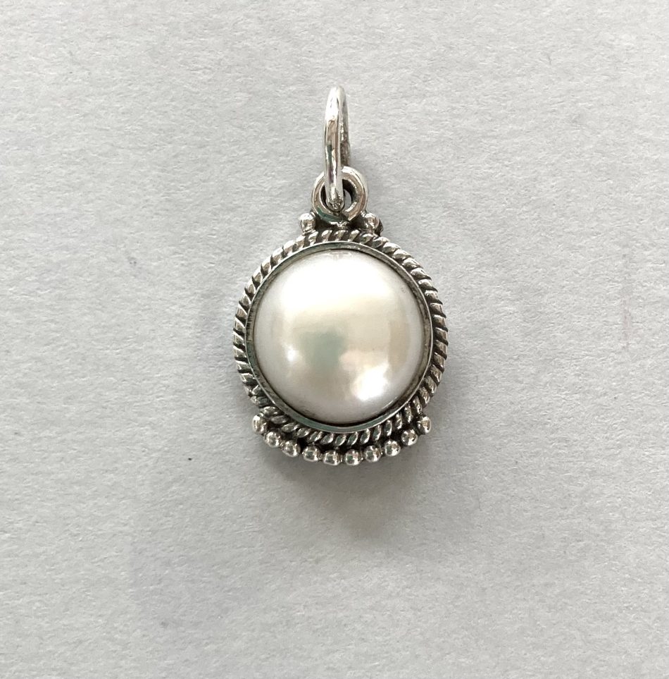 White pearl pendant with dotted Sterling silver detail