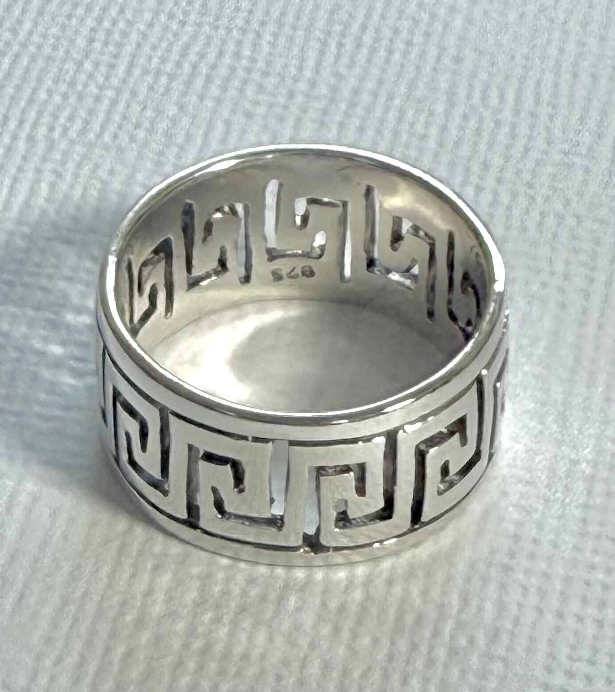 sterling silver band ring with a Greek key cutout design