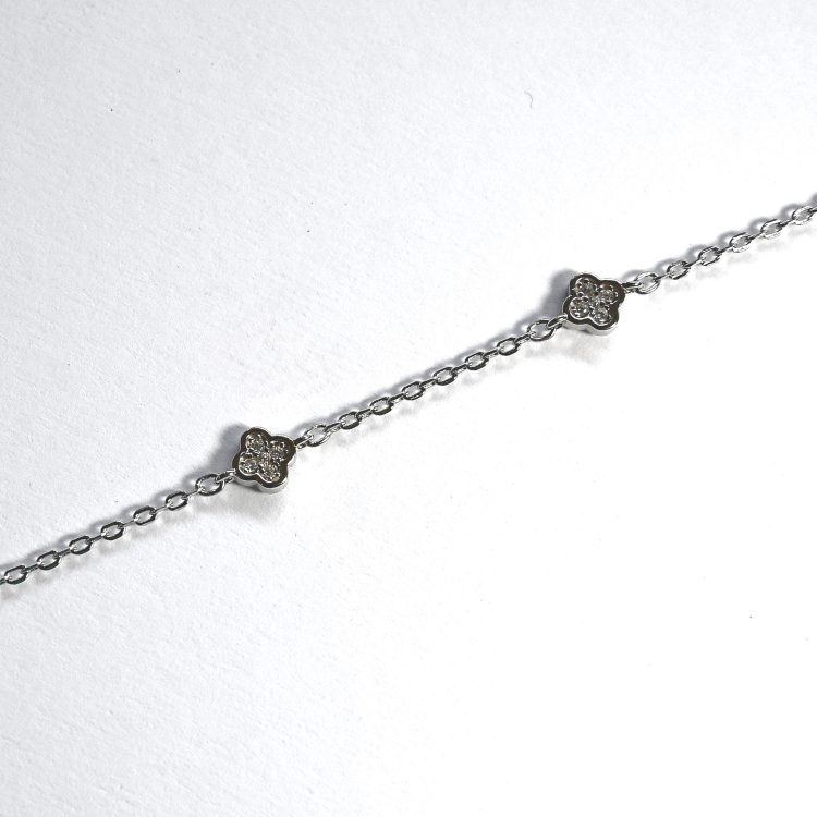 dainty sterling silver bracelet with cubic zirconia clovers