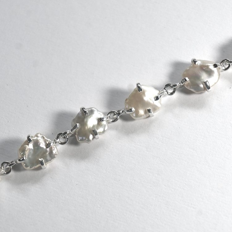 abstract shaped white pearl and sterling silver bracelet