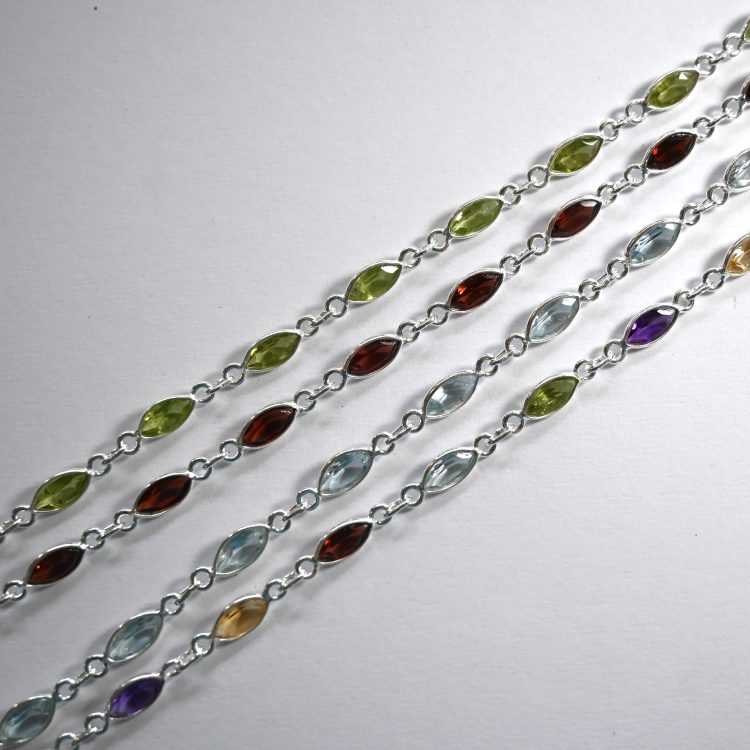 sterling silver and various elliptical faceted gemstone bracelet