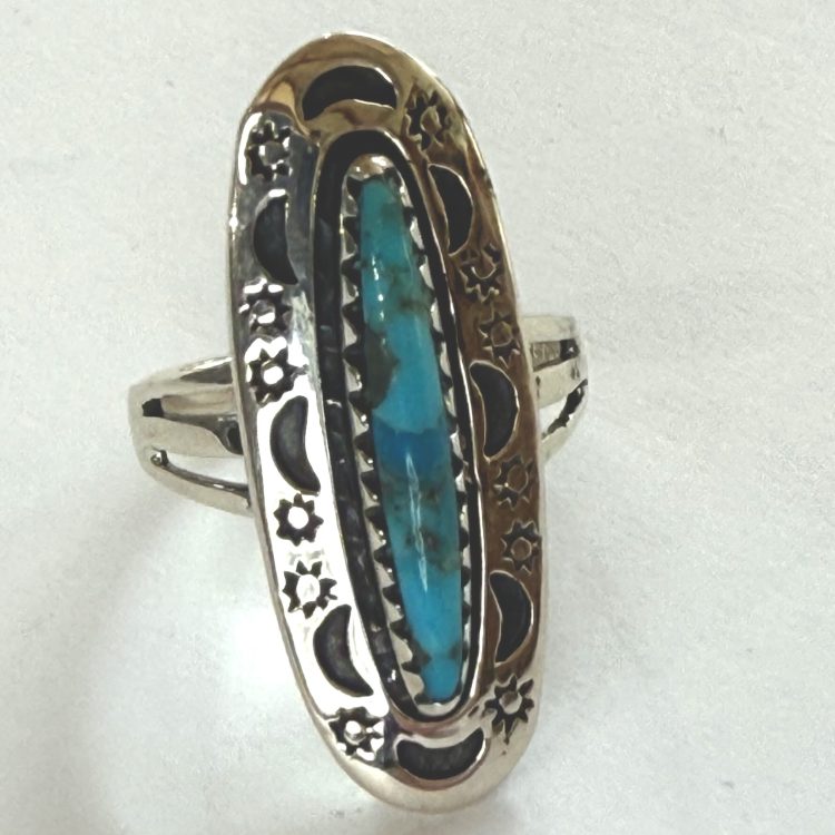 elliptical turquoise with sterling silver sun and moon border ring