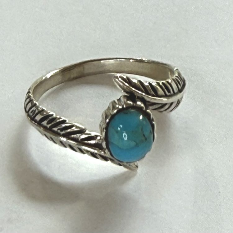 oval turquoise ring with sterling silver wrap around feather band