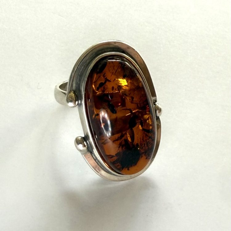 oval amber ring with sterling silver border