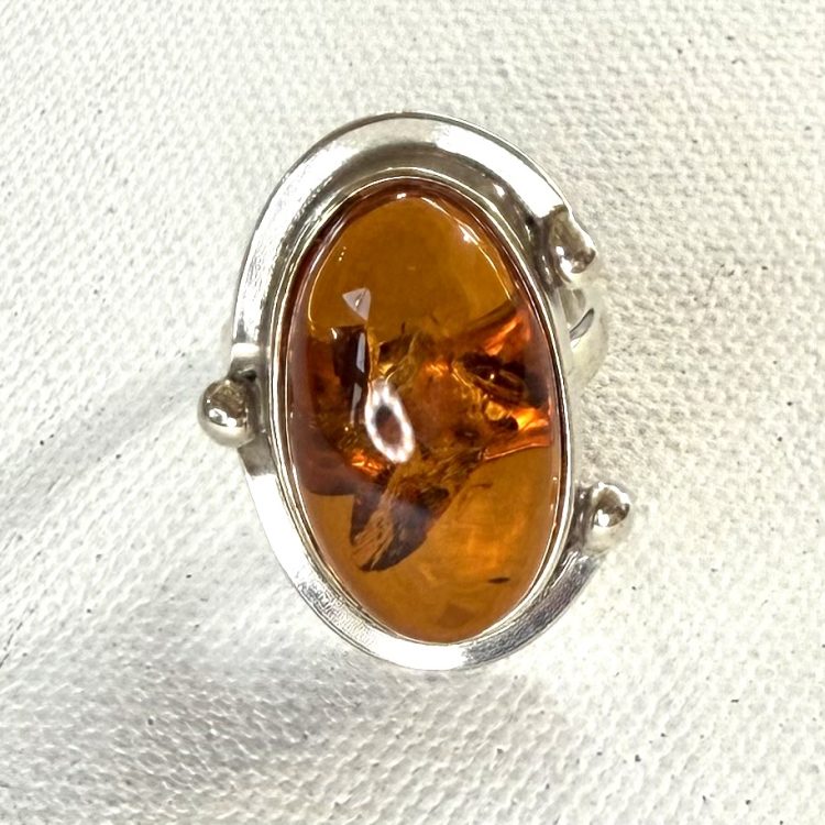 oval amber ring with sterling silver border