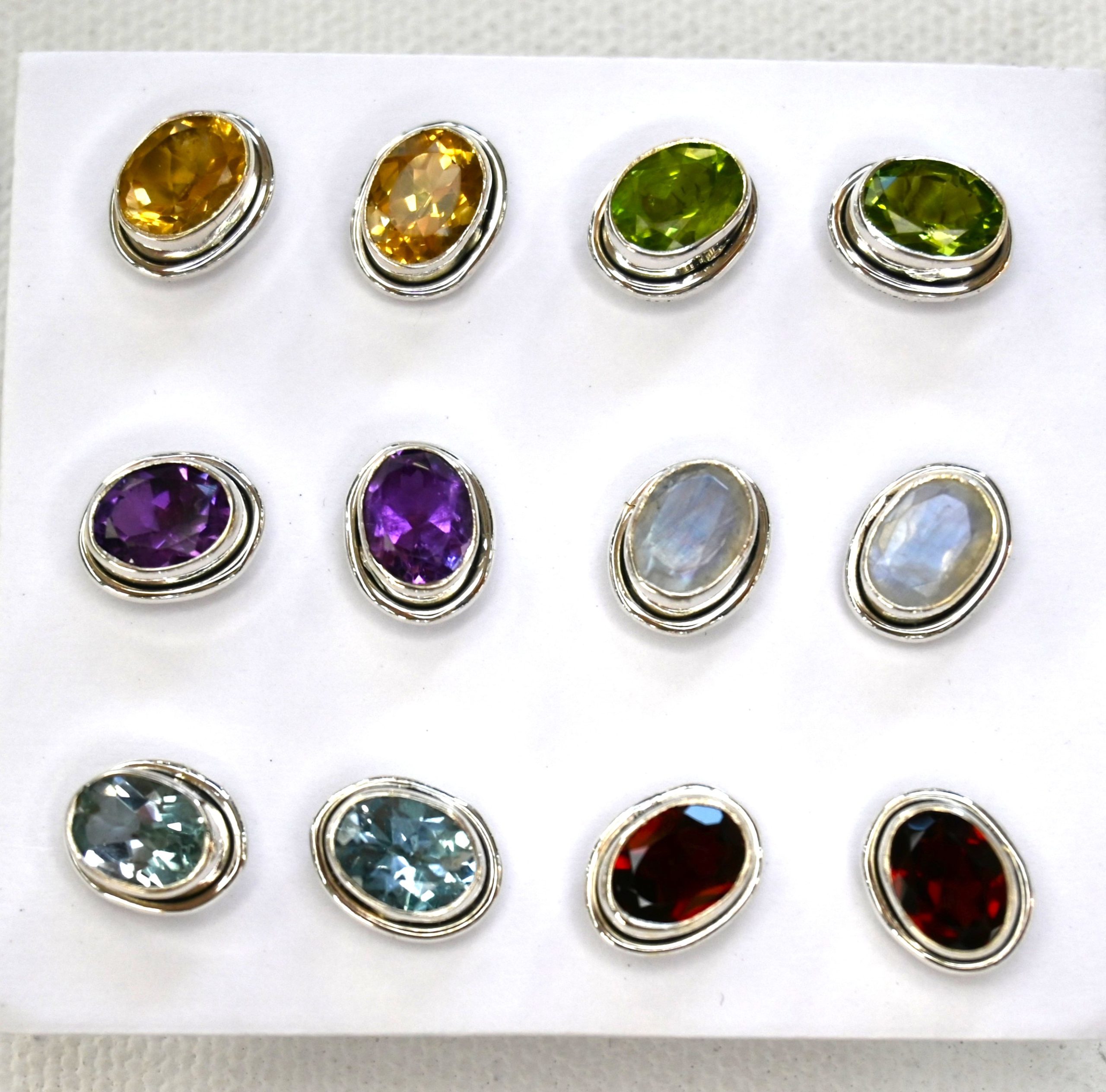 sterling silver and various gemstone faceted oval stud earrings