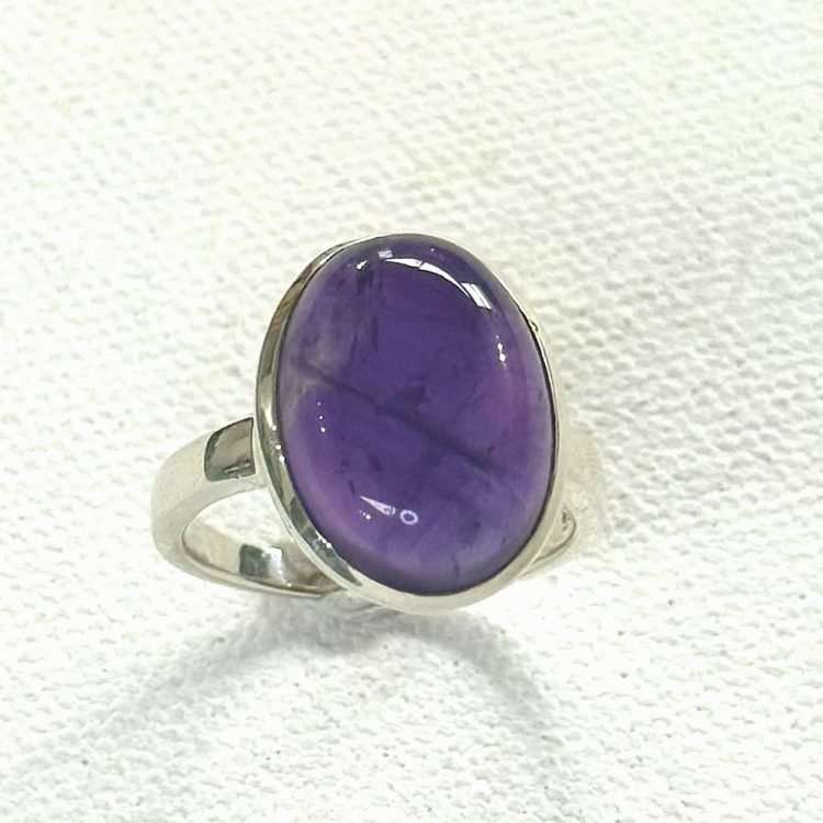 sterling silver and oval cabochon amethyst ring